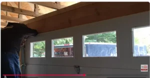 Newly installed garage door with window inserts viewed from inside